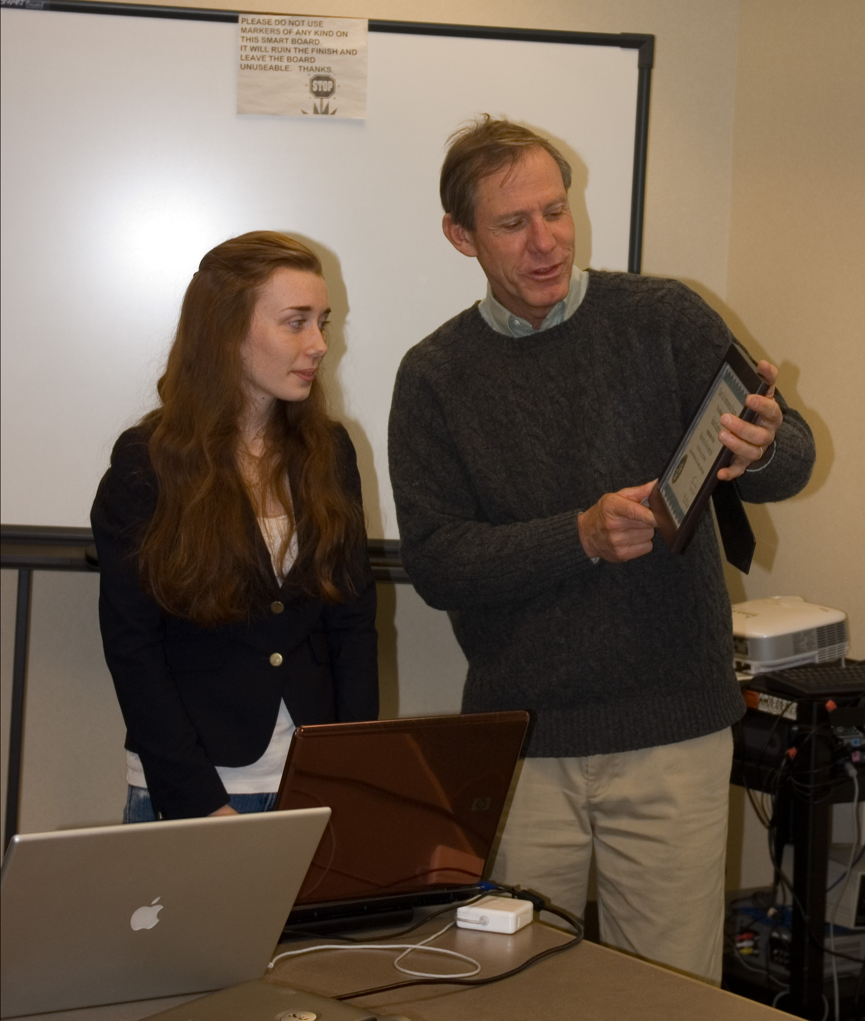 Kelsie Krafton accepts award on behalf of CCAS for her acomplishment of discovering two unknown asteroids from Society President Tom Leach